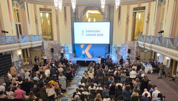 A packed Hall of Mirrors with Configura Awards 2026 displayed on the main screen