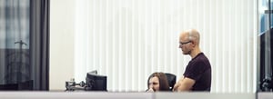 two men at a computer